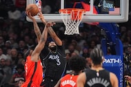 Dallas Mavericks forward Anthony Davis (3) drives to the basket against Houston Rockets...