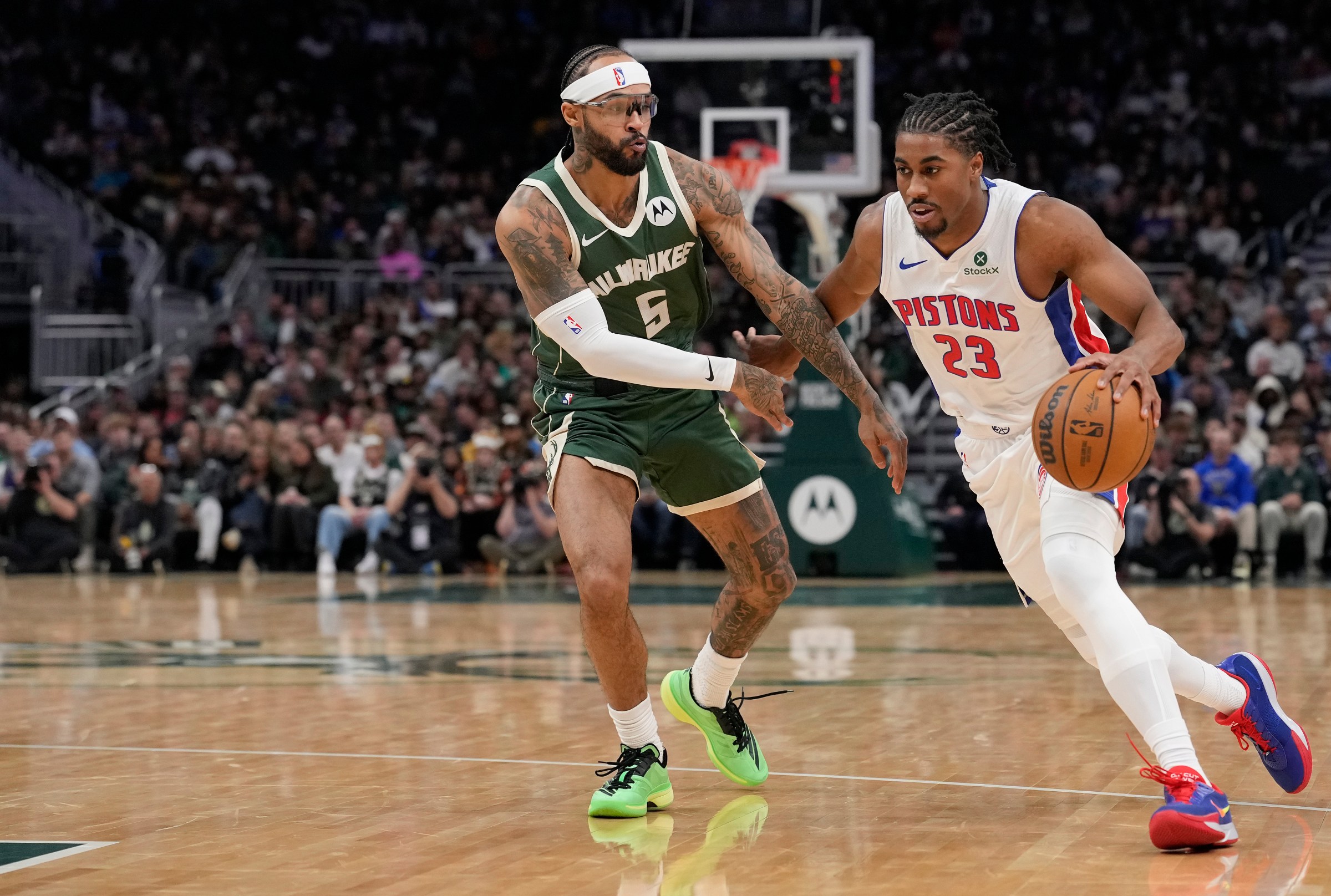 MILWAUKEE, WISCONSIN - NOVEMBER 22: Jaden Ivey #23 of the Detroit Pistons dribbles the ball against Gary Trent Jr. #5 of the Milwaukee Bucks during the third quarter at Fiserv Forum on November 22, 2025 in Milwaukee, Wisconsin. NOTE TO USER: User expressly acknowledges and agrees that, by downloading and or using this photograph, User is consenting to the terms and conditions of the Getty Images License Agreement. (Photo by Patrick McDermott/Getty Images)