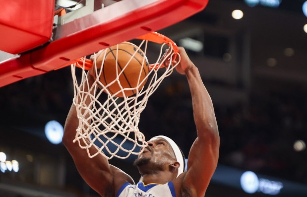 Golden State Warriors forward Jimmy Butler III (10) dunks the ball in the first quarter during a game against the Chicago Bulls, Sunday, Dec. 7, 2025, at the United Center in Chicago. (Dominic Di Palermo/Chicago Tribune)