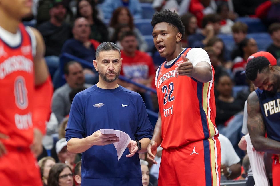New Orleans Pelicans center Derik Queen (22) talks to head coach James Borrego in the second...