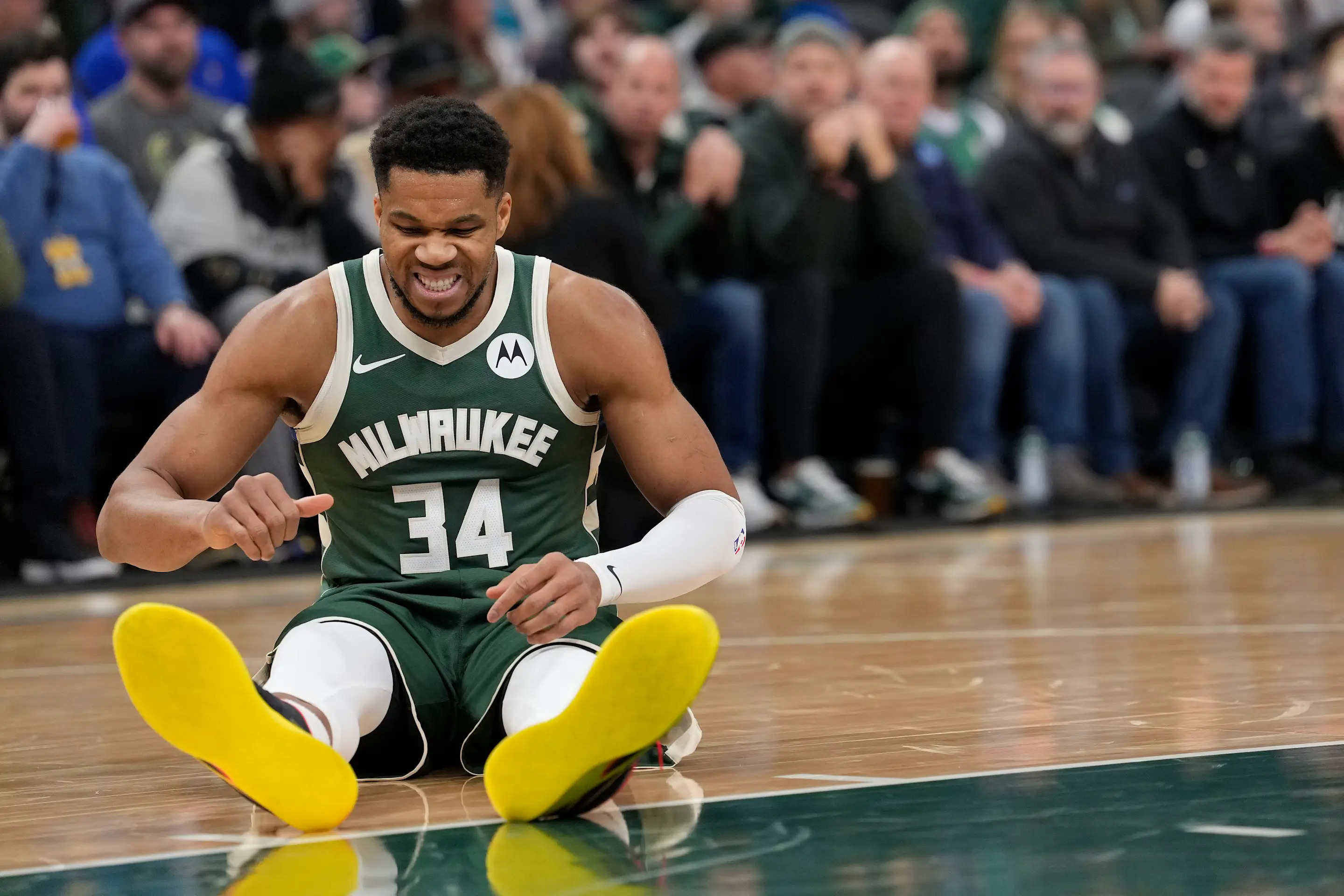 MILWAUKEE, WISCONSIN - DECEMBER 03: Giannis Antetokounmpo #34 of the Milwaukee Bucks reacts after an apparent injury against the Detroit Pistons during the first quarter at Fiserv Forum on December 03, 2025 in Milwaukee, Wisconsin. NOTE TO USER: User expressly acknowledges and agrees that, by downloading and or using this photograph, User is consenting to the terms and conditions of the Getty Images License Agreement. (Photo by Patrick McDermott/Getty Images)