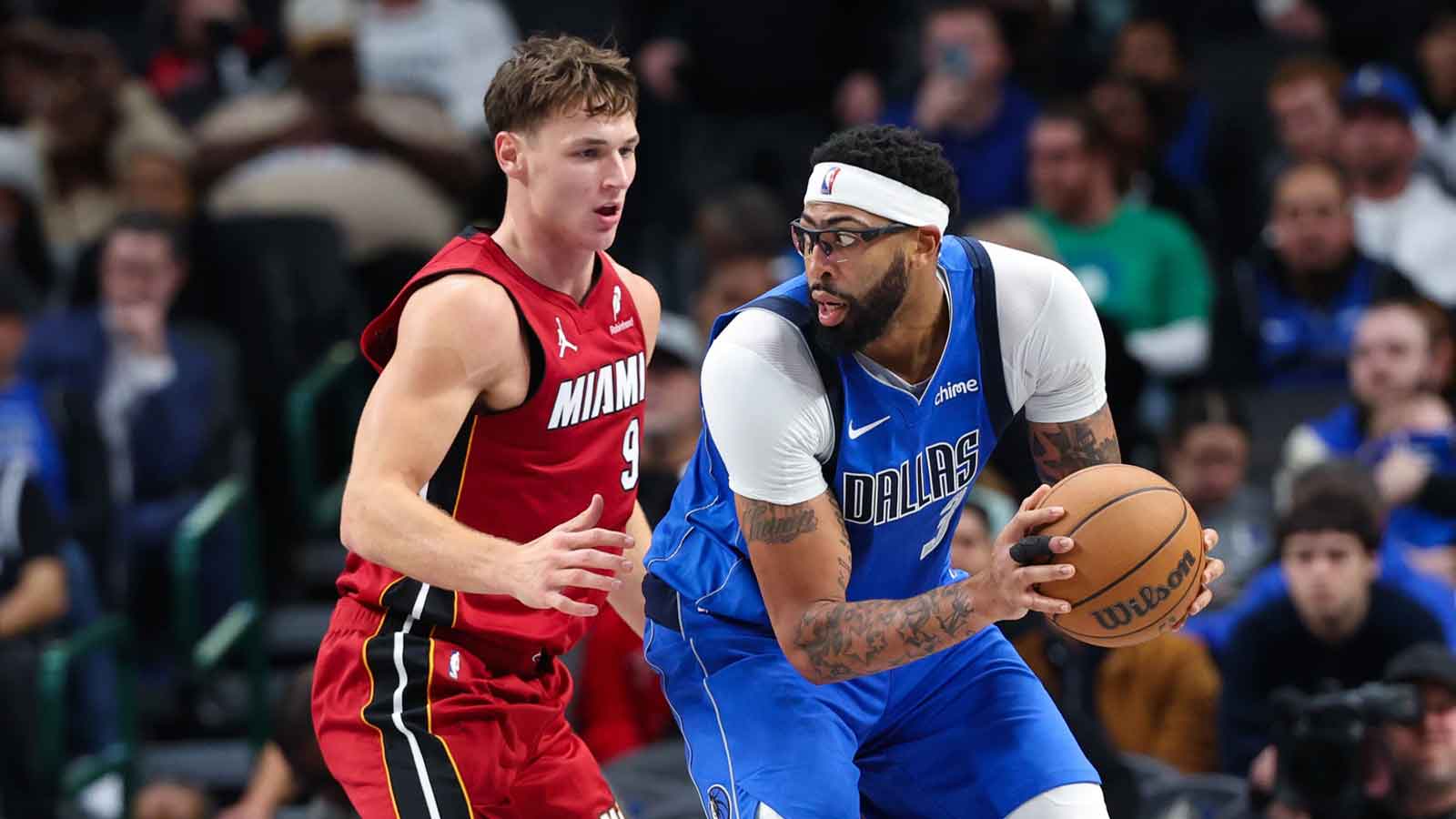 Dallas Mavericks forward Anthony Davis (3) controls the ball as Miami Heat guard Pelle Larsson (9) defends during the second half at American Airlines Center.