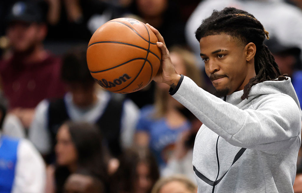 DALLAS, TEXAS - NOVEMBER 22: Ja Morant #12 of the Memphis Grizzlies looks on from the bench in the second half during timeout against the Dallas Mavericks at American Airlines Center on November 22, 2025 in Dallas, Texas. NOTE TO USER: User expressly acknowledges and agrees that, by downloading and or using this photograph, User is consenting to the terms and conditions of the Getty Images License Agreement. (Photo by Ron Jenkins/Getty Images)