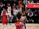 New York Knicks centre Karl-Anthony Towns shoots over Toronto Raptors forward Sandro Mamukelashvili earlier last month.