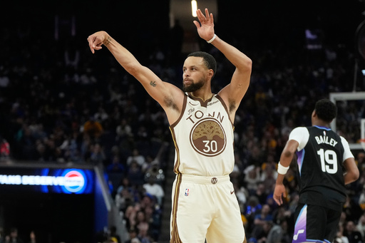 Golden State Warriors guard Stephen Curry (30) gestures after making a 3-point basket against the Utah Jazz during the second half of an NBA basketball game in San Francisco, Monday, Nov. 24, 2025. (AP Photo/Jeff Chiu)