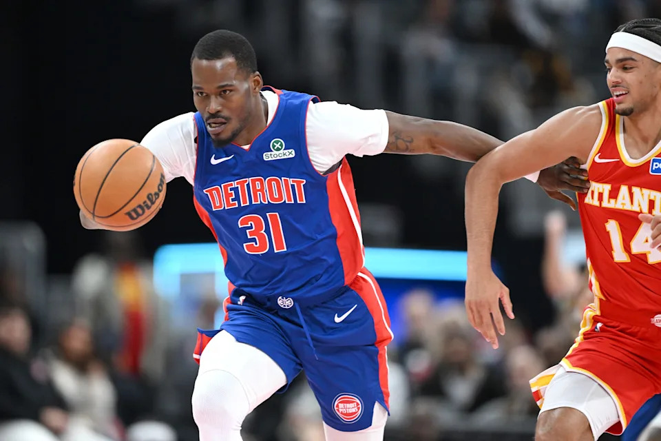 Detroit Pistons guard Javonte Green (31) drives past Atlanta Hawks forward Asa Newell (14) after stealing the ball from him in the second quarter at Little Caesars Arena in Detroit on Friday, Dec. 12, 2025.