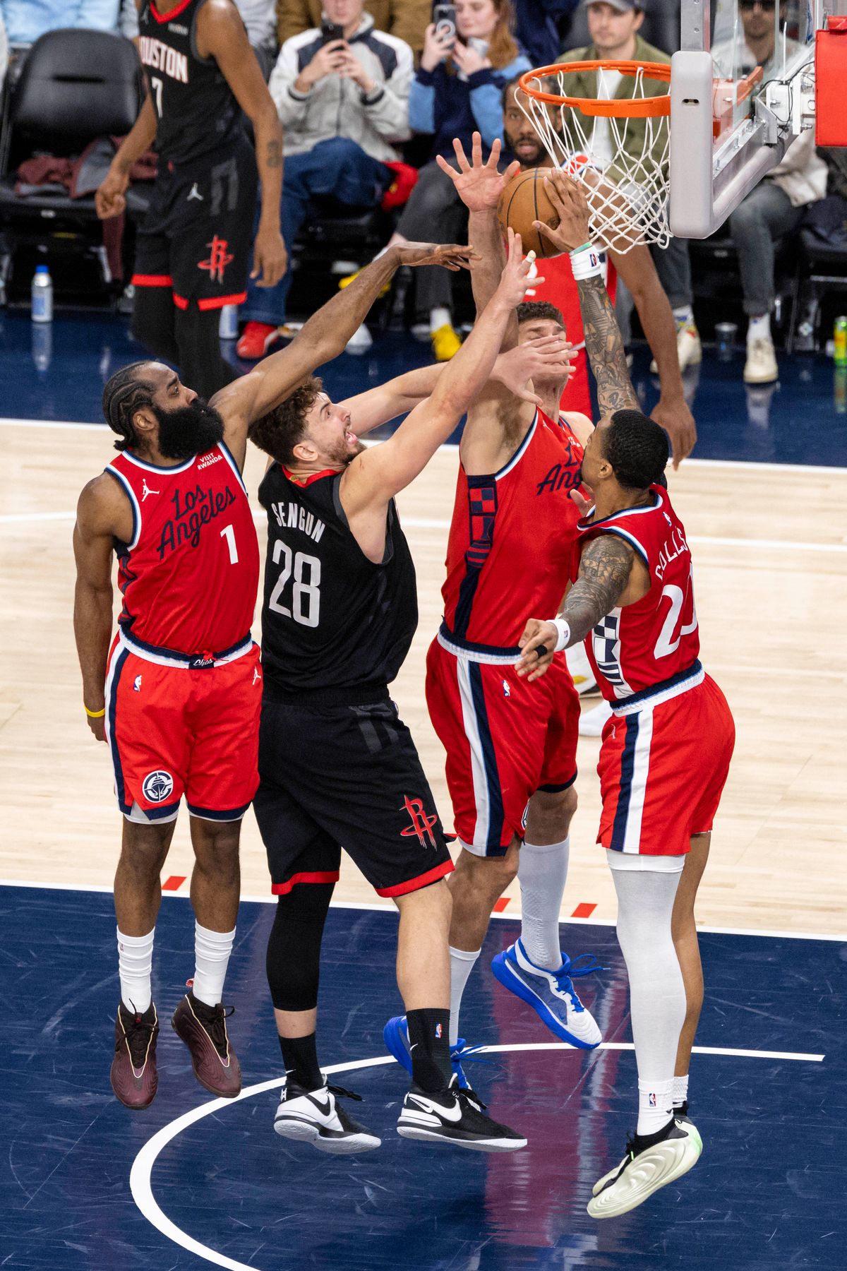 Alperen Sengun #28 of the Houston Rockets tries to lay the ball up in traffic during an NBA basketball game against the LA Clippers, Tuesday December 23, 2025 in Inglewood, Calif.