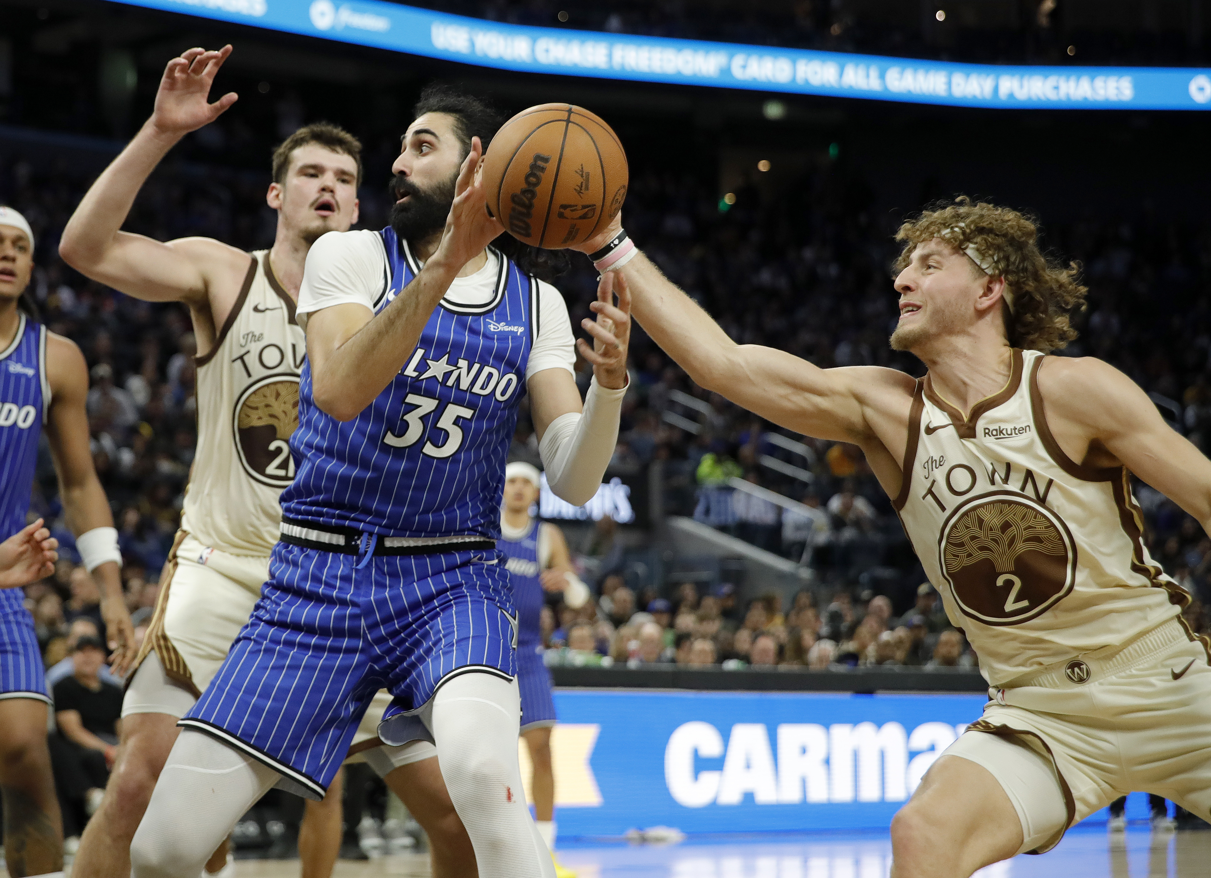 Golden State Warriors' Brandin Podziemski #2 knocks the ball away...