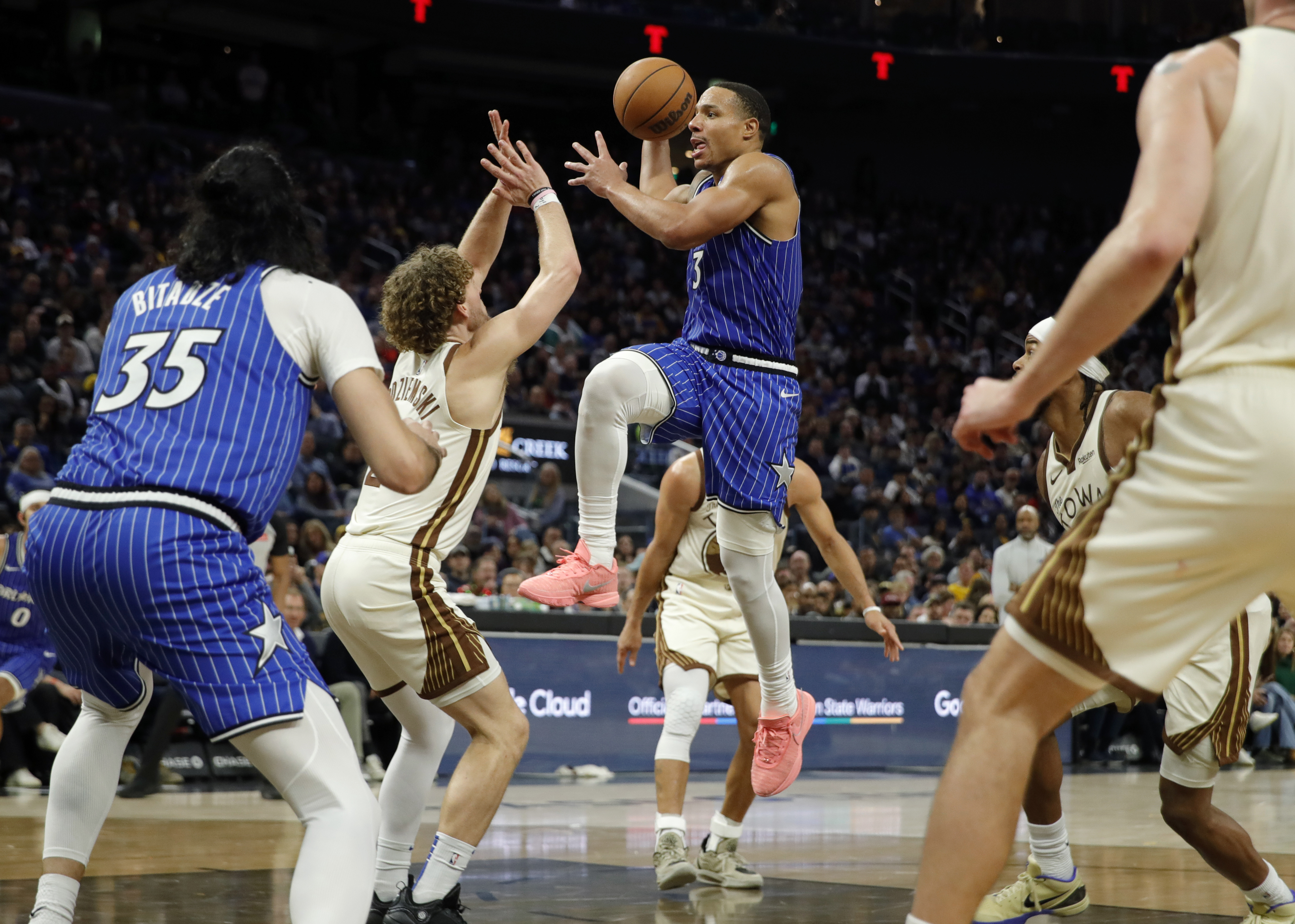 Orlando Magic's Desmond Bane #3 drives to the basket as...