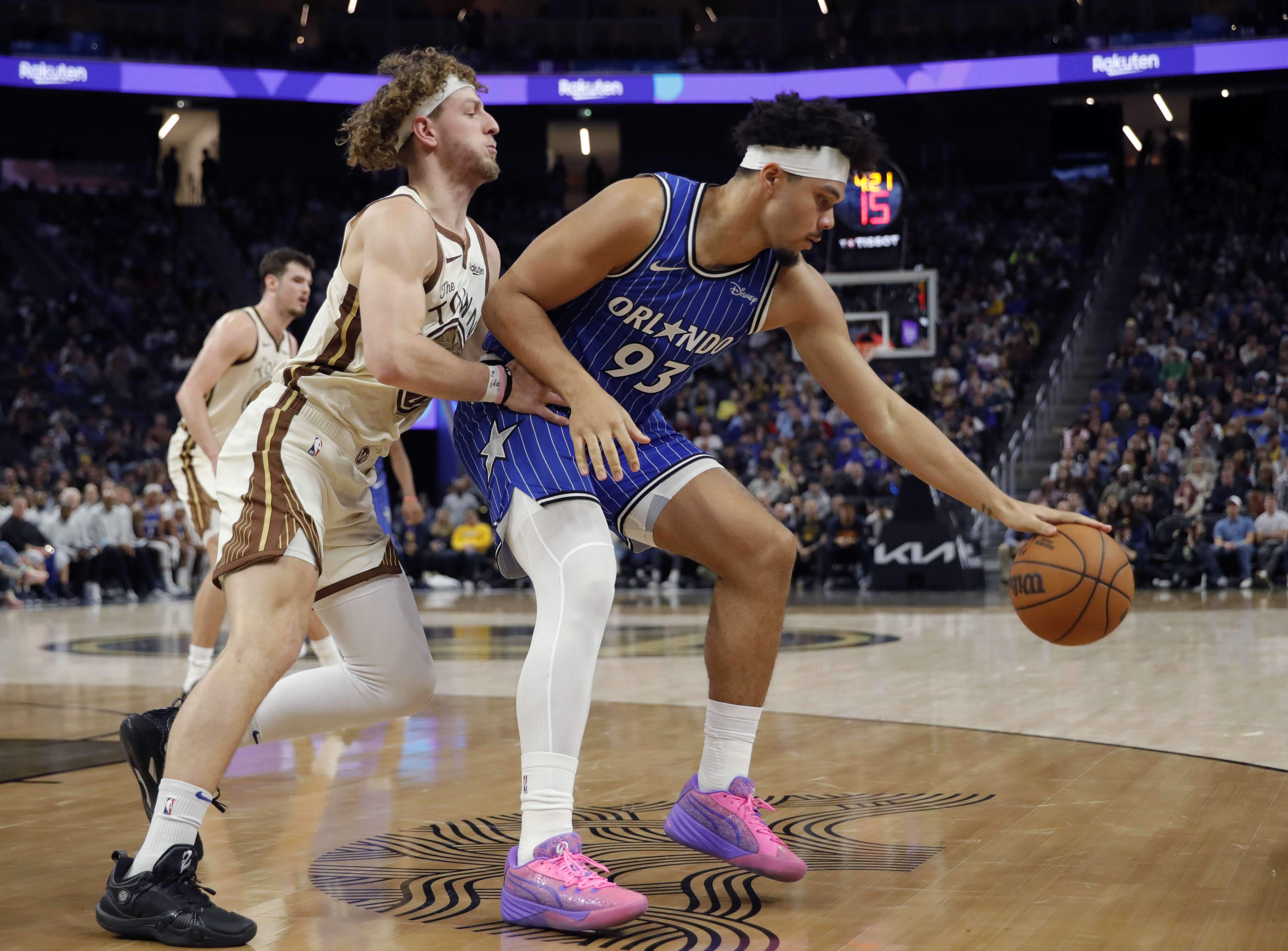 Golden State Warriors' Brandin Podziemski #2 guards Orlando Magic's Noah...