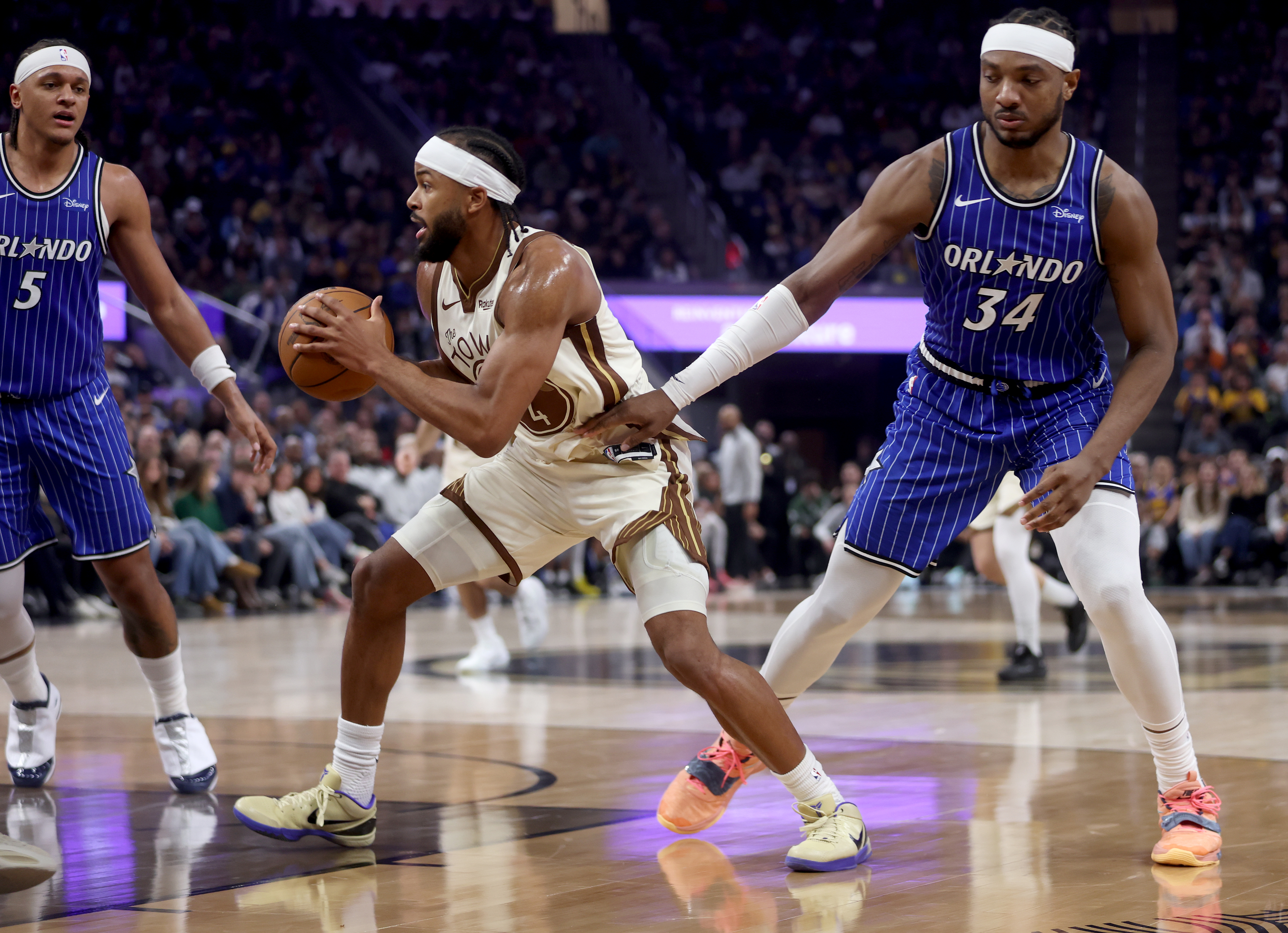 Golden State Warriors’ Moses Moody #4 looks to pass as...