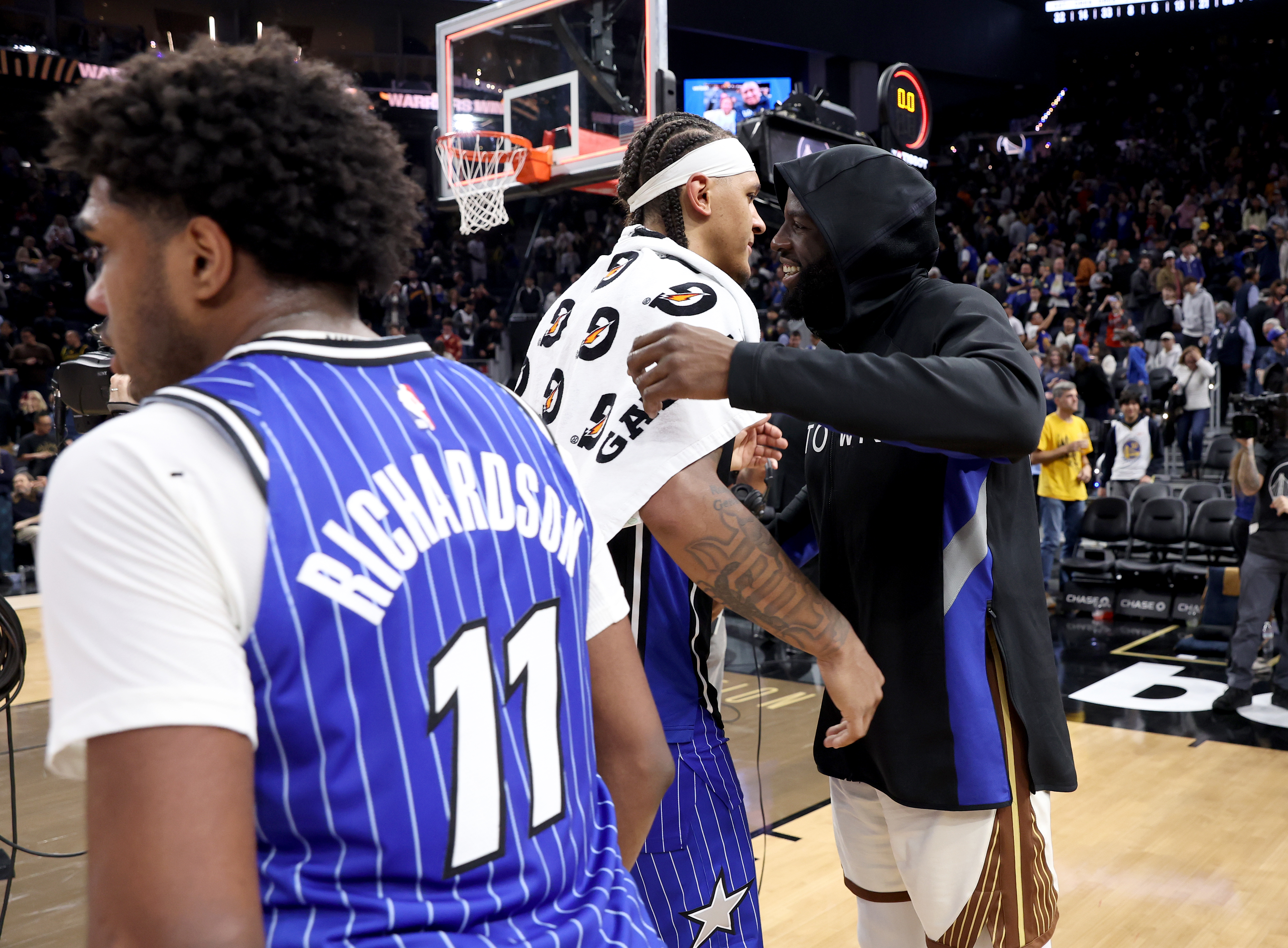 Golden State Warriors’ Draymond Green #23 is congratulated by Orlando...