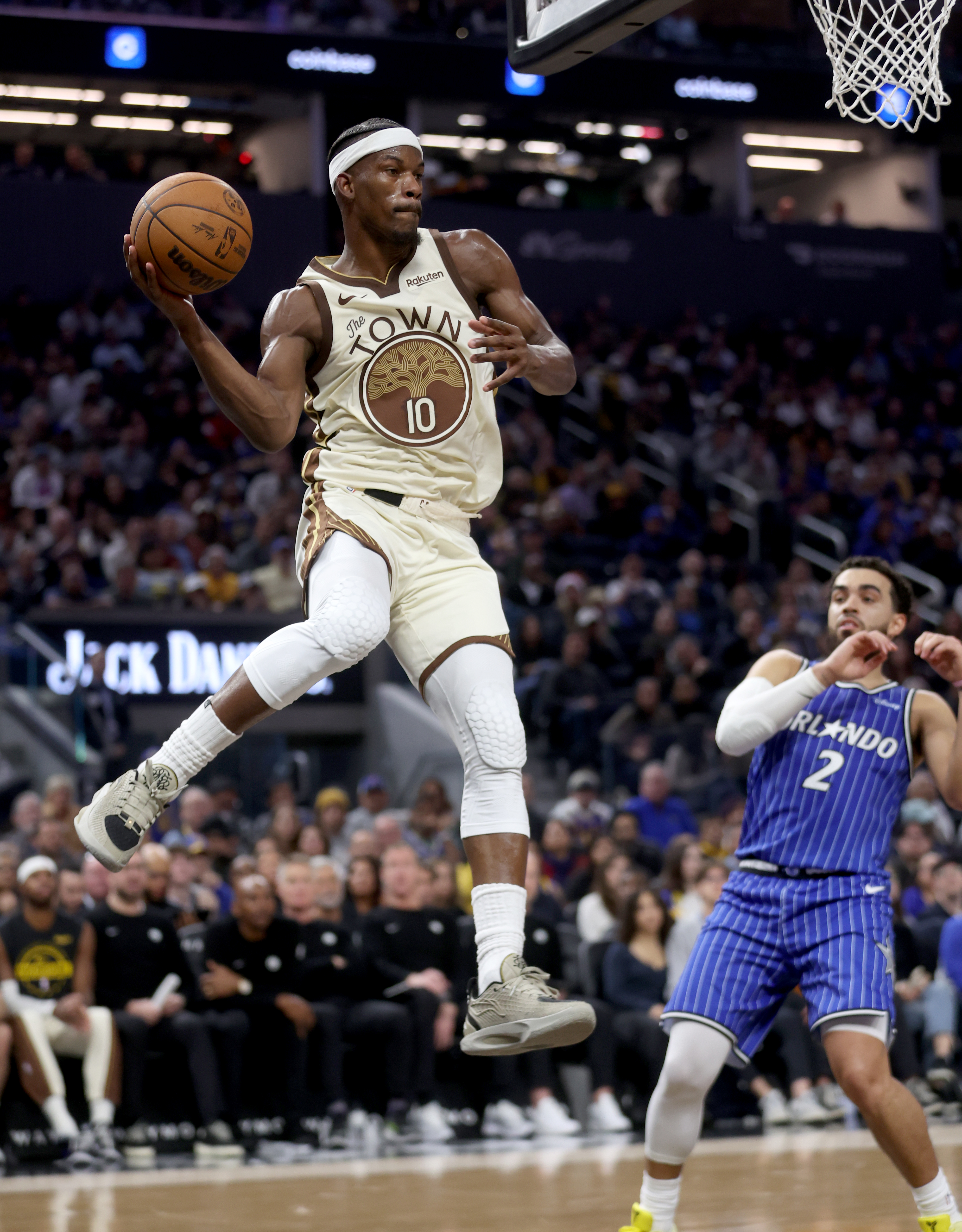 Golden State Warriors’ Jimmy Butler III #10 saves the ball...