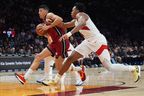 Miami Heat Simone Fontecchio (left) drives to the basket as Toronto Raptors forward Scottie Barnes, right, defends in Miami Tuesday night. Lynne Sladky/The Associated Press
