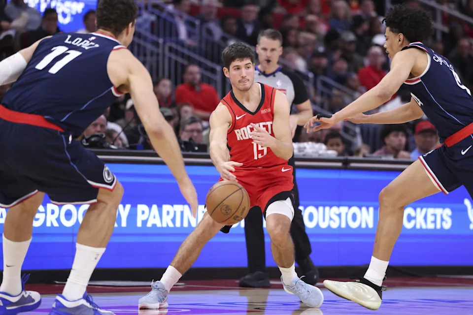 Dec 11, 2025; Houston, Texas, USA; Houston Rockets guard Reed Sheppard (15) passes the ball during the third quarter against the Los Angeles Clippers at Toyota Center. Mandatory Credit: Troy Taormina-Imagn Images