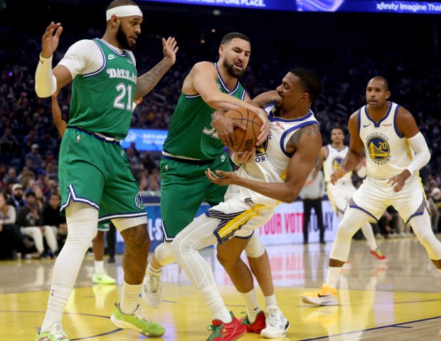A jump ball is called as Dallas Mavericks' Klay Thompson #31 and Golden State Warriors' De'Anthony Melton #8 battle for the ball in the first quarter of their NBA Christmas Day game at the Chase Center in San Francisco, Calif., on Thursday, Dec. 25, 2025. (Jane Tyska/Bay Area News Group)