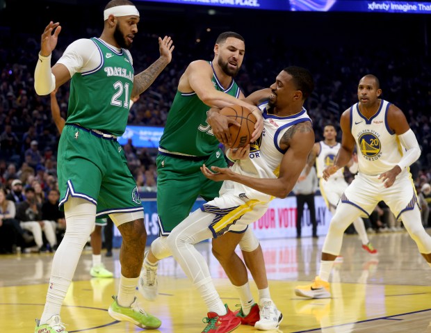 A jump ball is called as Dallas Mavericks' Klay Thompson #31 and Golden State Warriors' De'Anthony Melton #8 battle for the ball in the first quarter of their NBA Christmas Day game at the Chase Center in San Francisco, Calif., on Thursday, Dec. 25, 2025. (Jane Tyska/Bay Area News Group)