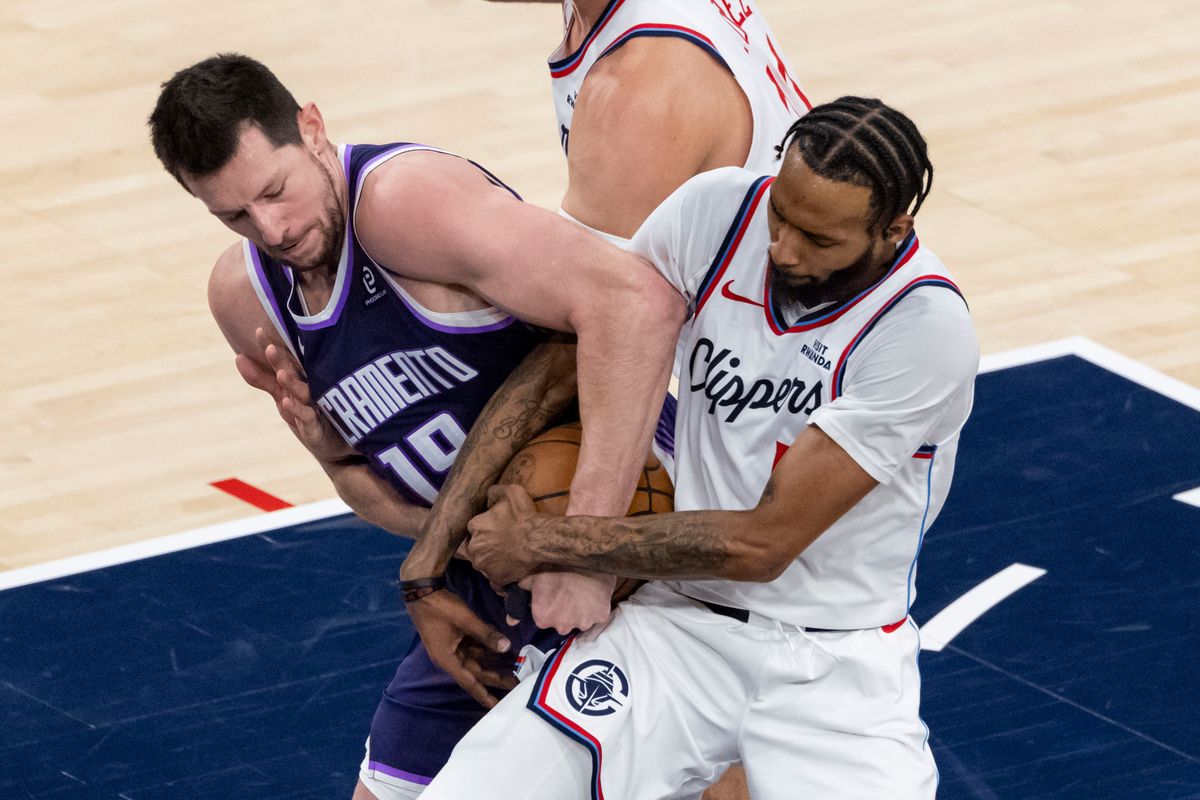 Drew Eubanks #19 of the Sacramento Kings and Derrick Jones Jr. #5 of the LA Clippers fight for the ball during an NBA basketball game, Tuesday December 30, 2025 in Inglewood, Calif. Drew Eubanks #19 of the Sacramento Kings and Derrick Jones Jr. #5 of the LA Clippers fight for the ball during an NBA basketball game, Tuesday December 30, 2025 in Inglewood, Calif.