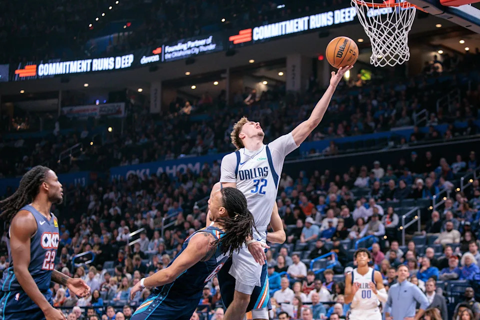 OKLAHOMA CITY, OKLAHOMA - DECEMBER 5: Cooper Flagg #32 of the Dallas Mavericks shoots the ball over Jaylin Williams #6 of the Oklahoma City Thunder during the second half at Paycom Center on December 5, 2025 in Oklahoma City, Oklahoma. NOTE TO USER: User expressly acknowledges and agrees that, by downloading and or using this photograph, User is consenting to the terms and conditions of the Getty Images License Agreement. (Photo by William Purnell/Getty Images)