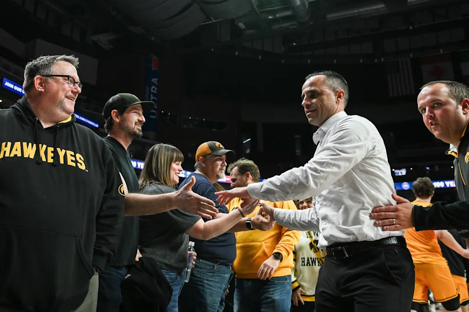 Dec 20, 2025; Iowa City, Iowa, USA; Iowa Hawkeyes head coach Ben McCollum reacts with fans after the game against the Bucknell Bison at Casey's Center. Mandatory Credit: Jeffrey Becker-Imagn Images