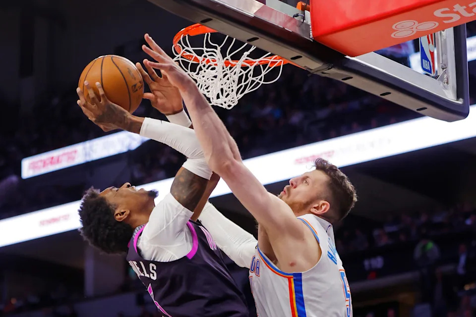Dec 19, 2025; Minneapolis, Minnesota, USA; Oklahoma City Thunder center Isaiah Hartenstein (55) defends against Minnesota Timberwolves forward Jaden McDaniels (3) in the third quarter at Target Center. Mandatory Credit: Bruce Kluckhohn-Imagn Images
