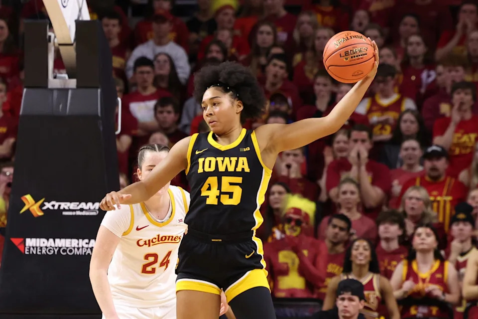 Dec 10, 2025; Ames, Iowa, USA; Iowa State Cyclones Addy Brown (24) defends Iowa Hawkeyes Hannah Stuelke (45) during there first half at James H. Hilton Coliseum. Mandatory Credit: Reese Strickland-Imagn Images