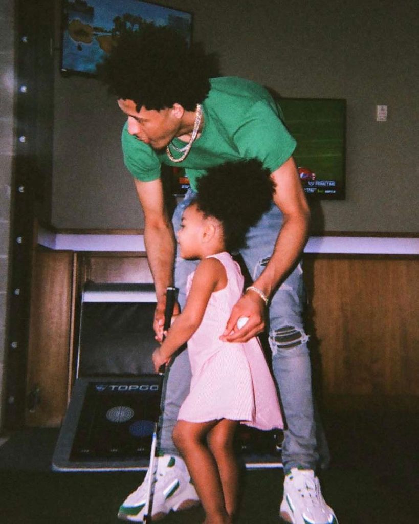 photo of cade cunningham with daughter