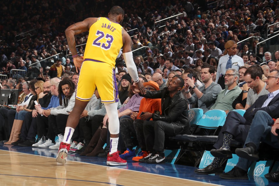 LeBron James #23 of the Los Angeles Lakers hi-fives Sports Agent, Rich Paul during the game against the New York Knicks on January 22, 2020