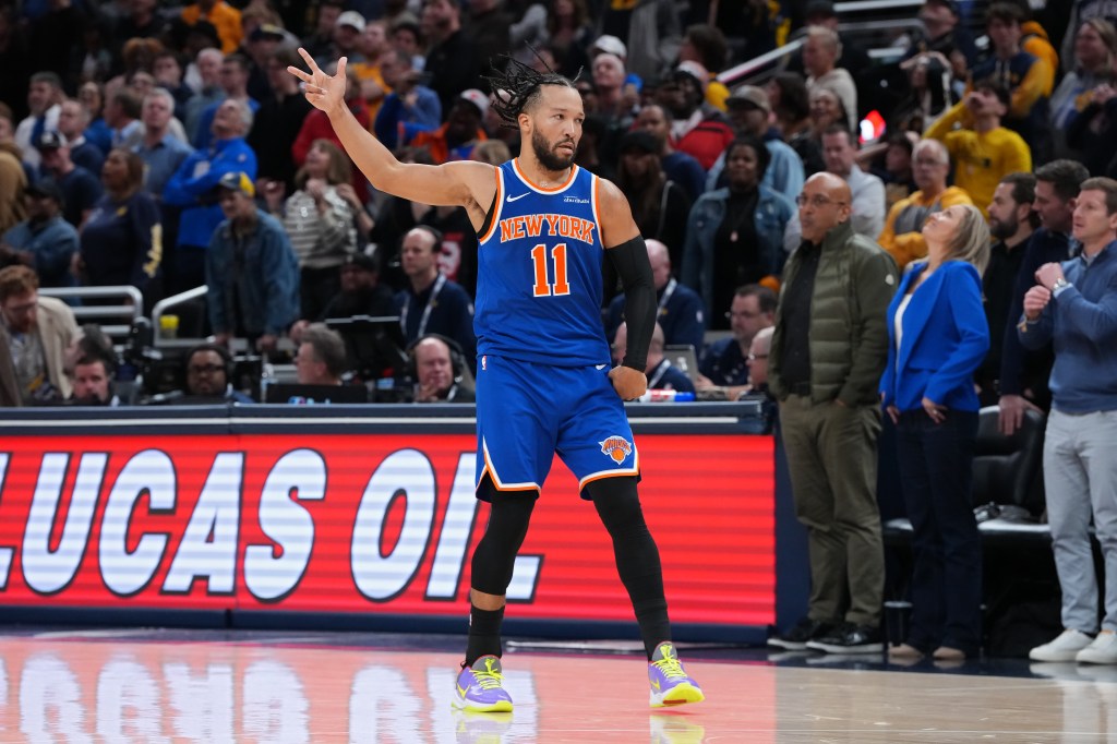 Jalen Brunson #11 of the New York Knicks celebrates after making a shot in the fourth quarter against the Indiana Pacers at Gainbridge Fieldhouse on December 18, 2025 in Indianapolis, Indiana. 