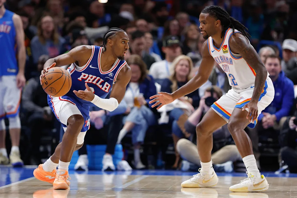 Dec 28, 2025; Oklahoma City, Oklahoma, USA; Philadelphia 76ers guard Tyrese Maxey (0) drives against Oklahoma City Thunder guard Cason Wallace (22) during the second half at Paycom Center. Mandatory Credit: Alonzo Adams-Imagn Images