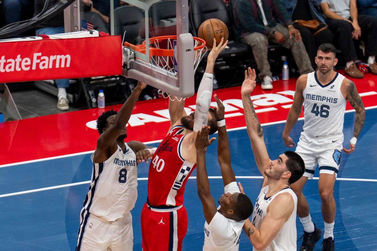Los Angeles Clippers center Ivica Zubac (40) gets a put back over three defenders during an NBA basketball game against the Memphis Grizzlies, Friday November 28th, 2025 in Los Angeles, California.