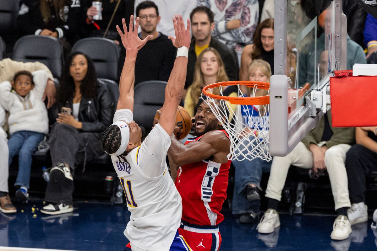 Kawhi Leonard #2 of the LA Clippers drives towards the rim against Jaxson Hayes #11 of the Los Angeles Lakers during an NBA basketball game, Saturday December 20, 2025 in Inglewood, Calif.