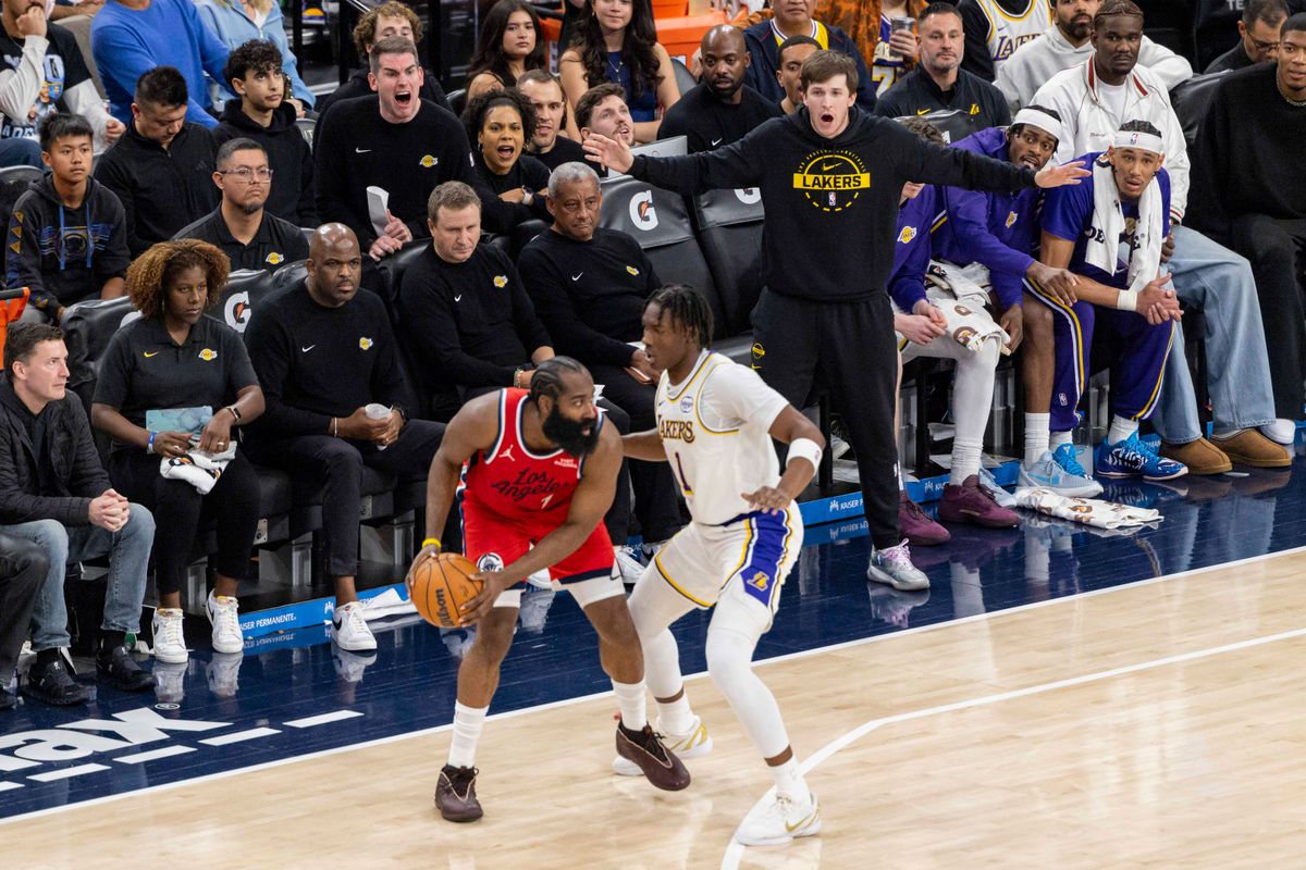 The Los Angeles Lakers bench yells instructions to the defense during an NBA basketball game against the LA Clippers, Saturday December 20, 2025 in Inglewood, Calif.