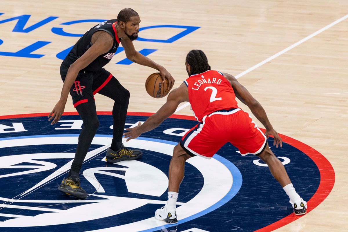 Kevin Durant #7 of the Houston Rockets handles the ball against Kawhi Leonard #2 of the LA Clippers during an NBA basketball game, Tuesday December 23, 2025 in Inglewood, Calif.