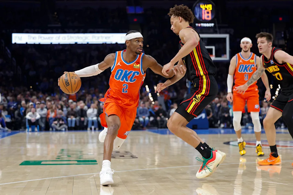 Dec 29, 2025; Oklahoma City, Oklahoma, USA; Oklahoma City Thunder guard Shai Gilgeous-Alexander (2) drives around Atlanta Hawks guard Dyson Daniels (5) during the second half at Paycom Center. Mandatory Credit: Alonzo Adams-Imagn Images
