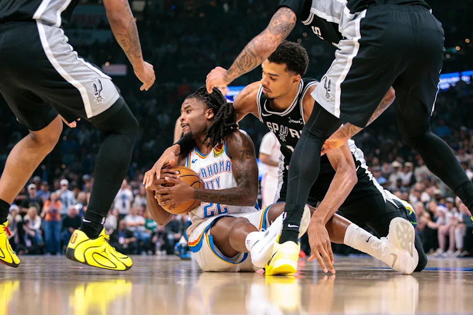 OKLAHOMA CITY, OKLAHOMA - DECEMBER 25: Cason Wallace #22 of the Oklahoma City Thunder protects the ball during the first half against the San Antonio Spurs at Paycom Center on December 25, 2025 in Oklahoma City, Oklahoma. NOTE TO USER: User expressly acknowledges and agrees that, by downloading and or using this photograph, User is consenting to the terms and conditions of the Getty Images License Agreement. (Photo by William Purnell/Getty Images)