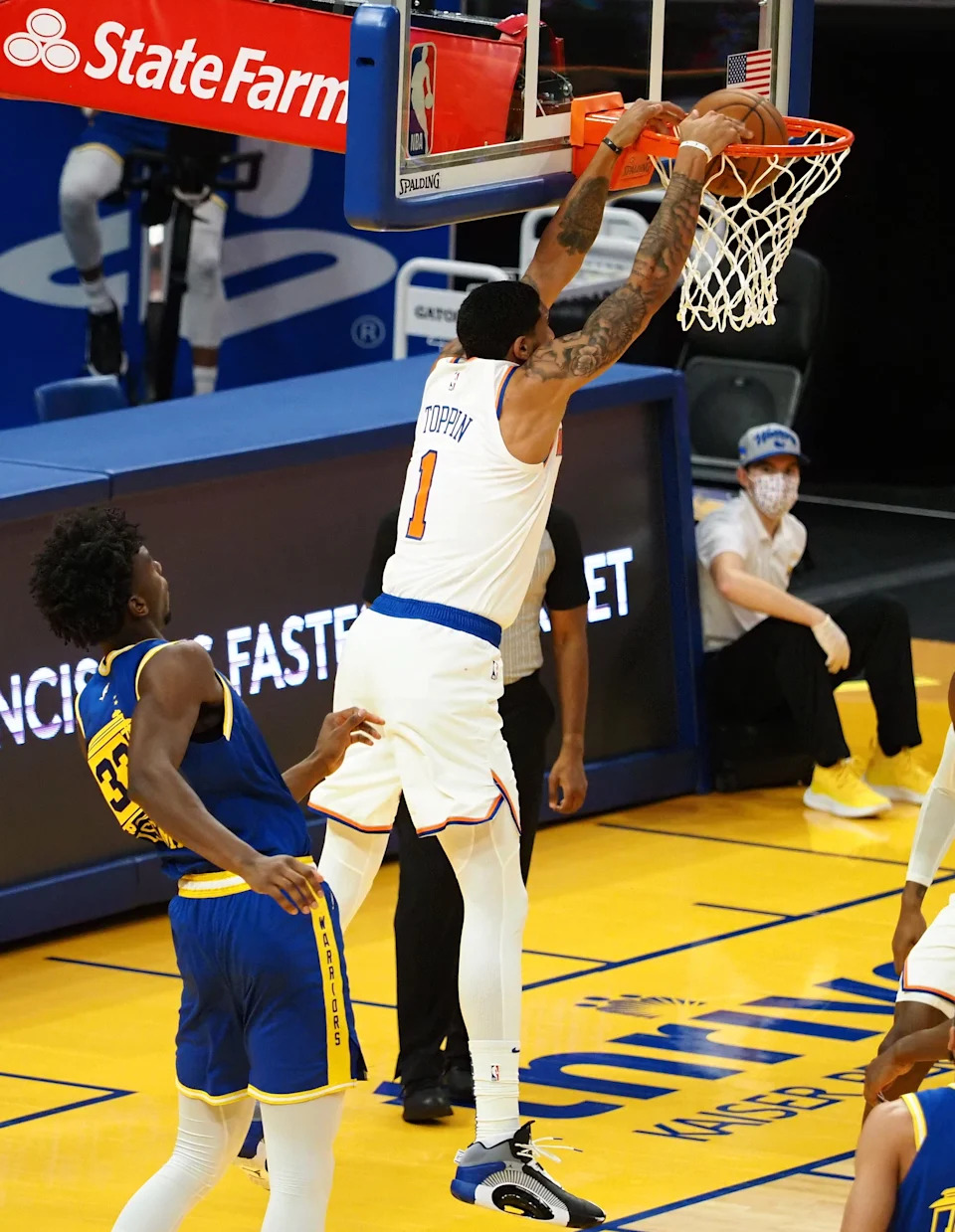 Jan 21, 2021; San Francisco, California, USA; New York Knicks forward Obi Toppin (1) dunks the ball above Golden State Warriors center James Wiseman (33) during the fourth quarter at Chase Center.