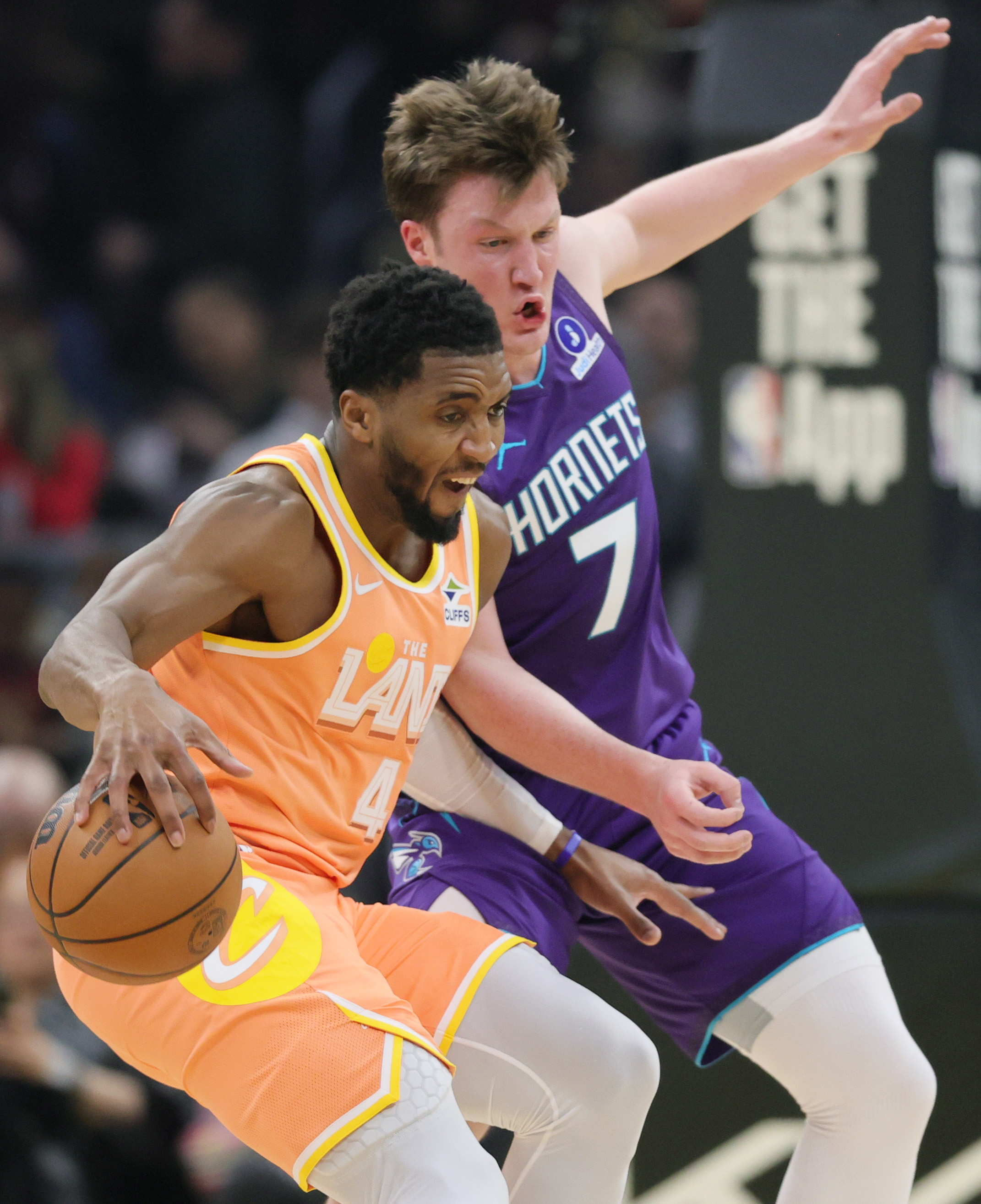 Cleveland Cavaliers guard Donovan Mitchell makes a spin move on the defense of Charlotte Hornets guard Kon Knueppel in the first half at Rocket Arena.