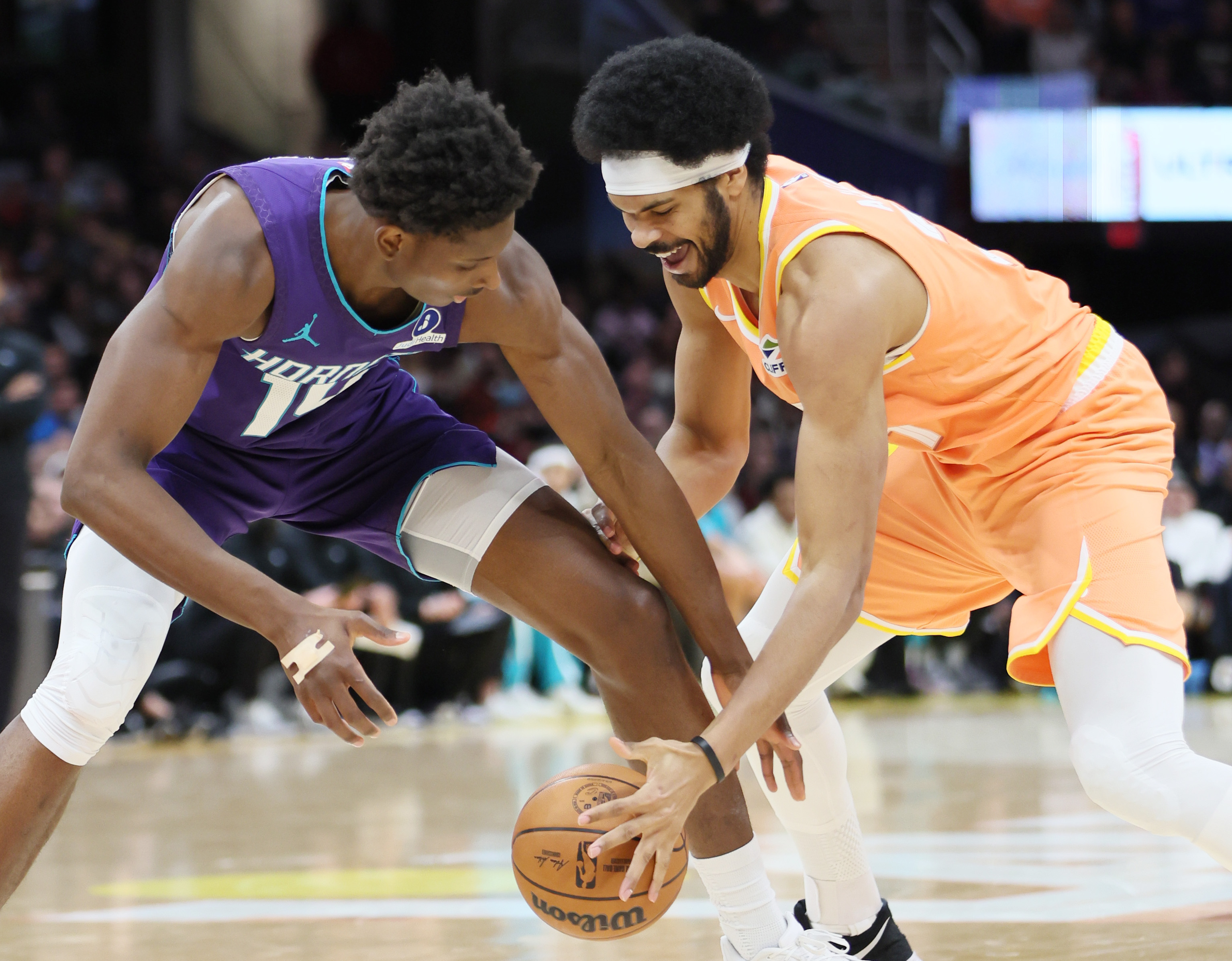 Charlotte Hornets forward Moussa Diabate (L) ad Cleveland Cavaliers center Jarrett Allen fight for possession of a loose ball in the second half at Rocket Arena.