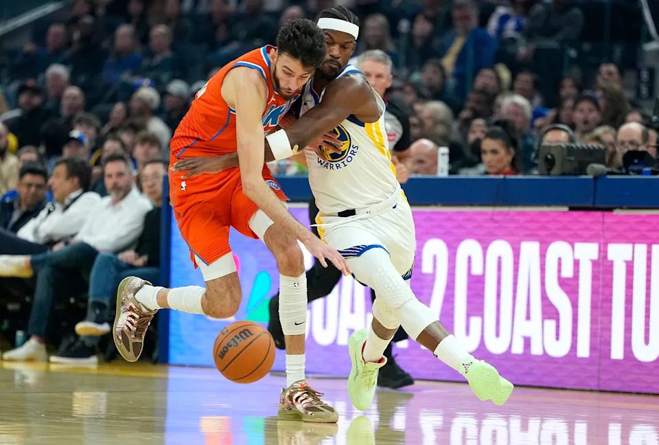 SAN FRANCISCO, CALIFORNIA - DECEMBER 02: Chet Holmgren #7 of the Oklahoma City Thunder and Jimmy Butler III #10 of the Golden State Warriors fight for a loose ball in the first half at Chase Center on December 02, 2025 in San Francisco, California. NOTE TO USER: User expressly acknowledges and agrees that, by downloading and or using this photograph, User is consenting to the terms and conditions of the Getty Images License Agreement. (Photo by Thearon W. Henderson/Getty Images)