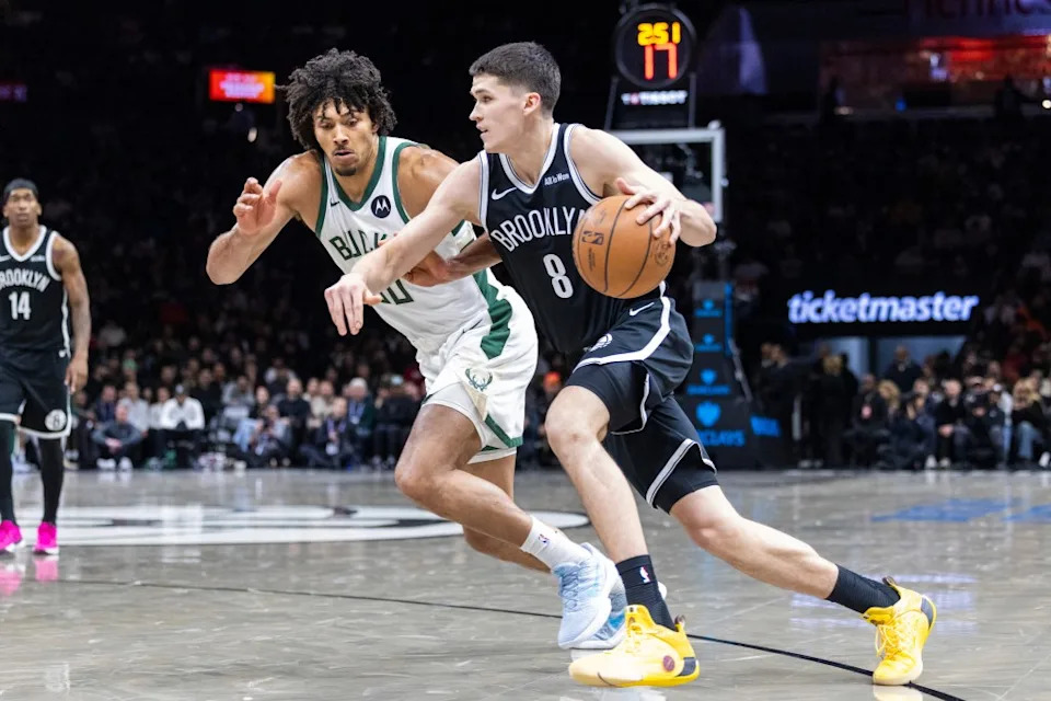 Egor Demin #8 of the Brooklyn Nets drives to the basket as Jericho Sims #00 of the Milwaukee Bucks defends during the first half at Barclays Center, Sunday, Dec. 14, 2025, in Brooklyn, NY. Corey Sipkin for the NY POST