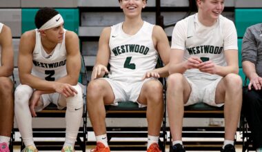 From left, Westwood captains Robert Liriano-Alejandro, Adrian Ortiz and Ty Pindel soaked in the moment as the Wolverines finished off a Tri-Valley League win over visiting Norwood Sunday.