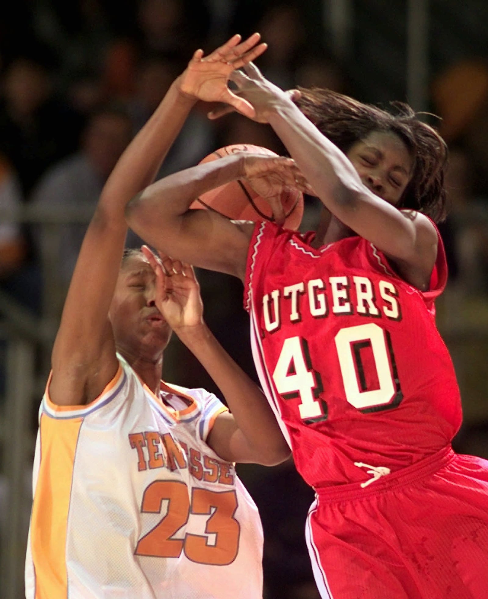Tennessee's Chamique Holdsclaw (23) and Rutgers' Linda Miles (40) fight for the ball in the second half at the NCAA Women's Mideast Regional Saturday, March 21, 1998 in Nashville, Tenn. (AP Photo/John Bazemore)
