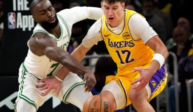 Jaylen Brown (right), stealing the ball from Lakers forward Jake Laravia in the Celtics' blowout victory Friday night, has preached patience and remained positive.