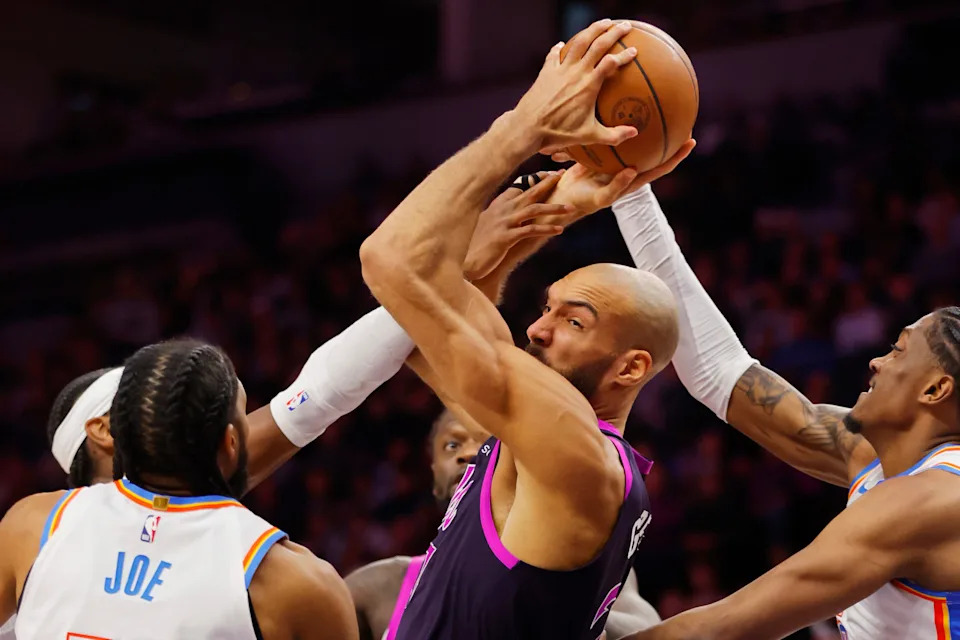 Dec 19, 2025; Minneapolis, Minnesota, USA; Minnesota Timberwolves center Rudy Gobert (27) wrestles the ball away from the Oklahoma City Thunder in the third quarter at Target Center. Mandatory Credit: Bruce Kluckhohn-Imagn Images
