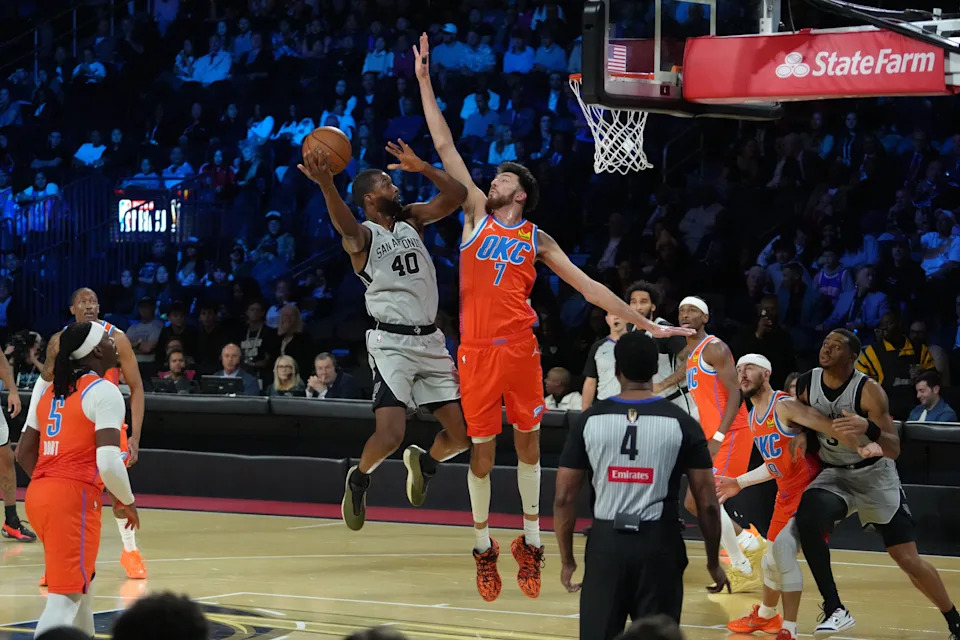 Dec 13, 2025; Las Vegas, Nevada, USA; San Antonio Spurs forward Harrison Barnes (40) looks to shoot over Oklahoma City Thunder center Chet Holmgren (7) during the first half at T-Mobile Arena. Mandatory Credit: Kirby Lee-Imagn Images