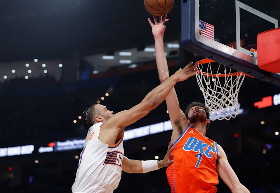 Dec 10, 2025; Oklahoma City, Oklahoma, USA; Oklahoma City Thunder center Chet Holmgren (7) blocks a shot by Phoenix Suns forward Dillon Brooks (3) during the second quarter at Paycom Center. Mandatory Credit: Alonzo Adams-Imagn Images