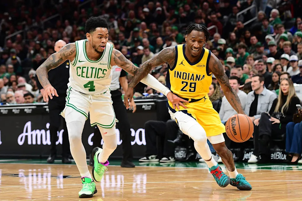 Dec 22, 2025; Boston, Massachusetts, USA; Indiana Pacers guard Quenton Jackson (29) controls the ball while Boston Celtics guard Anfernee Simons (4) defends during the second half at TD Garden. Mandatory Credit: Bob DeChiara-Imagn Images