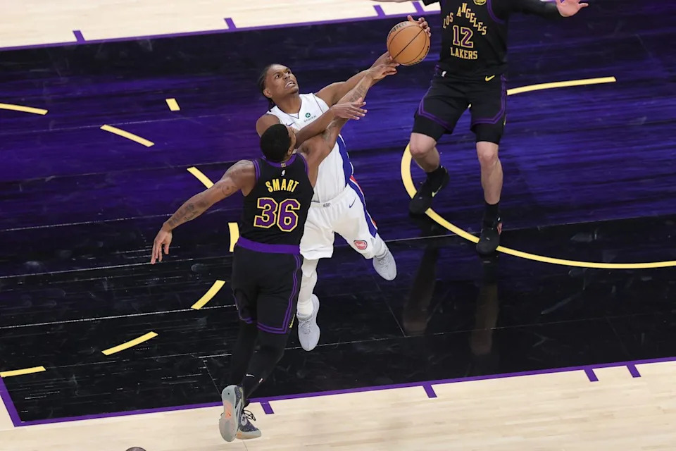 #36 PG Marcus Smart of the Los Angeles Lakers attempts to steal the ball from #9 G/F Ausar Thompson of the Detroit Pistons during an NBA game on December 30, 2025 in Los Angeles, CA.