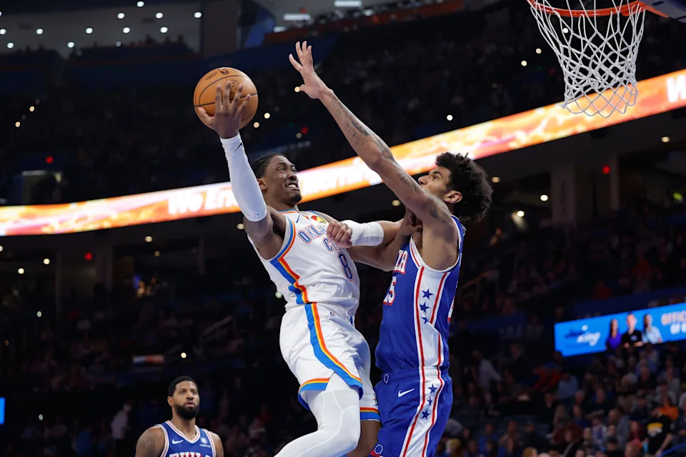 Dec 28, 2025; Oklahoma City, Oklahoma, USA; Oklahoma City Thunder guard Jalen Williams (8) goes to the basket as Philadelphia 76ers forward Dominick Barlow (25) defends during the second half at Paycom Center. Mandatory Credit: Alonzo Adams-Imagn Images